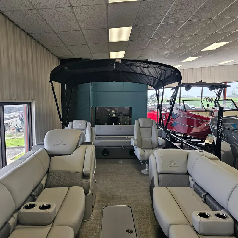 Slide: The Image of 2024 Regency 250 LE3 Sport pontoon boat interior with luxurious seating and canopy. - 5