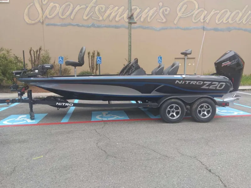 Slide: The Image of 2024 Nitro Z20 Pro fishing boat parked in a Sportsman's Paradise lot. - 0