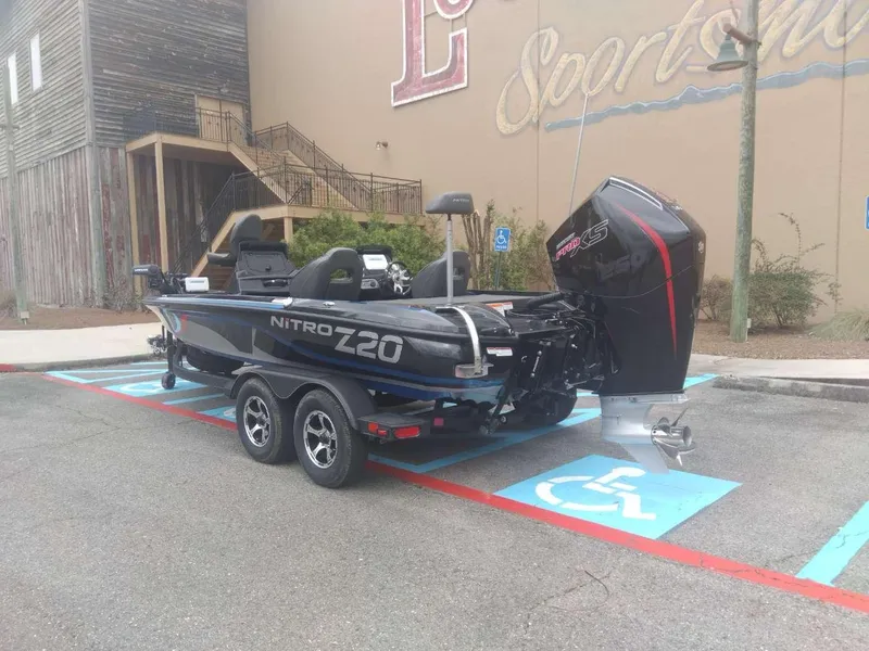 Slide: The Image of 2024 Nitro Z20 Pro boat parked in a handicap spot outside a sporting goods store. - 1