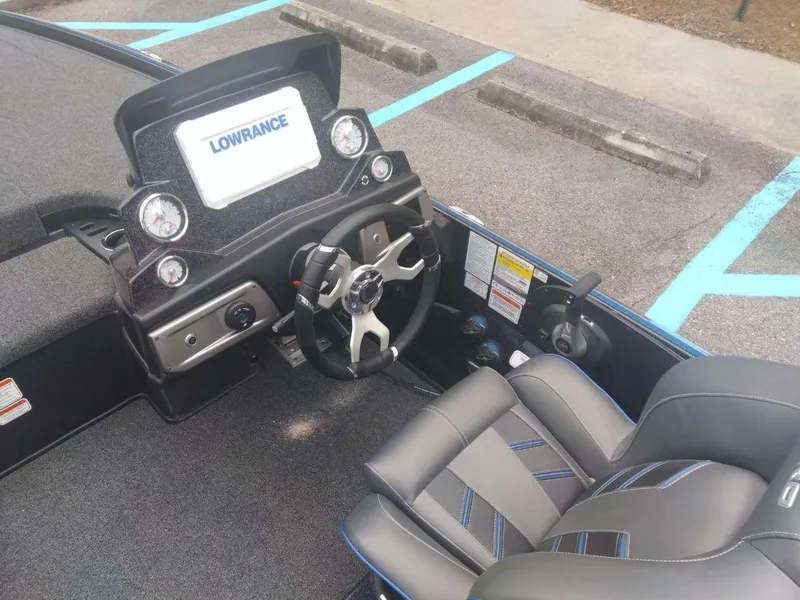 Slide: The Image of 2024 Nitro Z20 Pro boat cockpit with Lowrance electronics and modern steering wheel. - 11