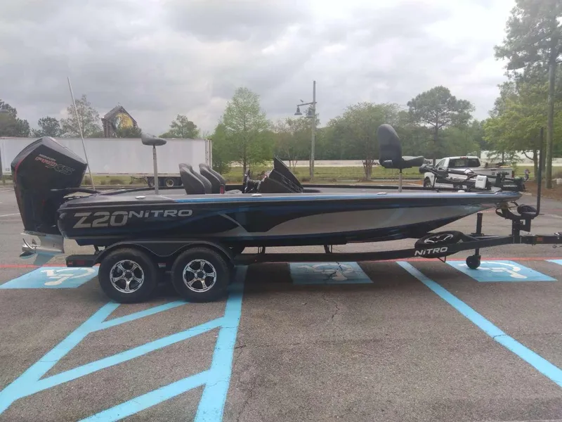 Slide: The Image of 2024 Nitro Z20 Pro boat on a trailer in a parking lot. - 4
