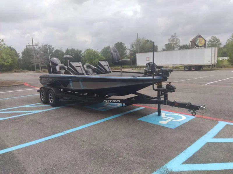 Slide: The Image of 2024 Nitro Z20 Pro fishing boat parked in a lot. - 5