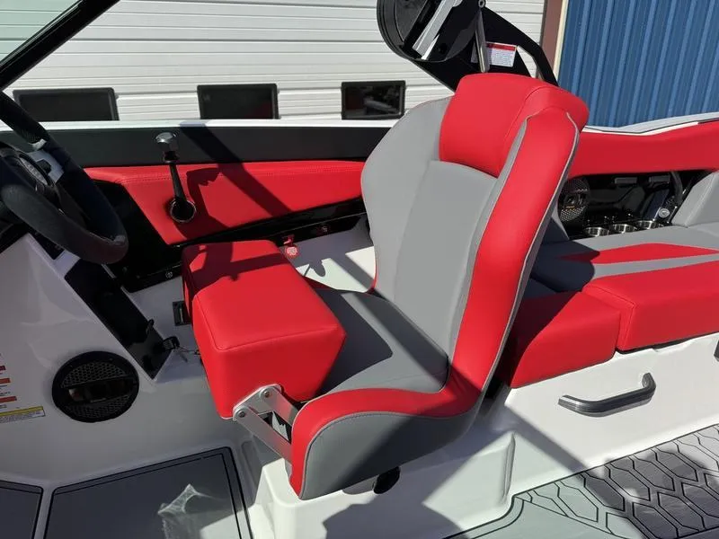 Slide: The Image of 2024 MasterCraft NXT 22 boat interior with red and gray seating. - 12