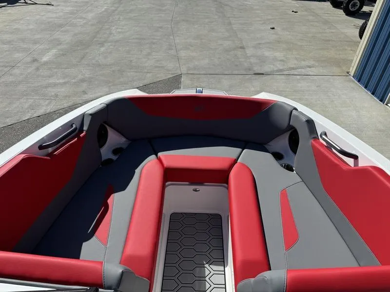 Slide: The Image of 2024 MasterCraft NXT 22 boat interior with red and gray seating. - 13
