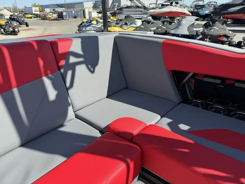 Slide: The Image of 2024 MasterCraft NXT 22 boat interior with red and gray seating. - 14