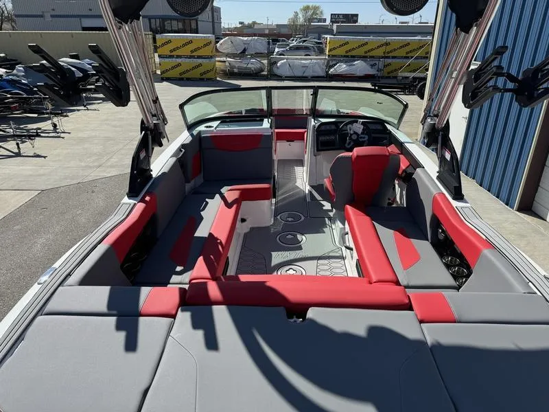 Slide: The Image of 2024 MasterCraft NXT 22 boat interior with red and gray seating. - 15