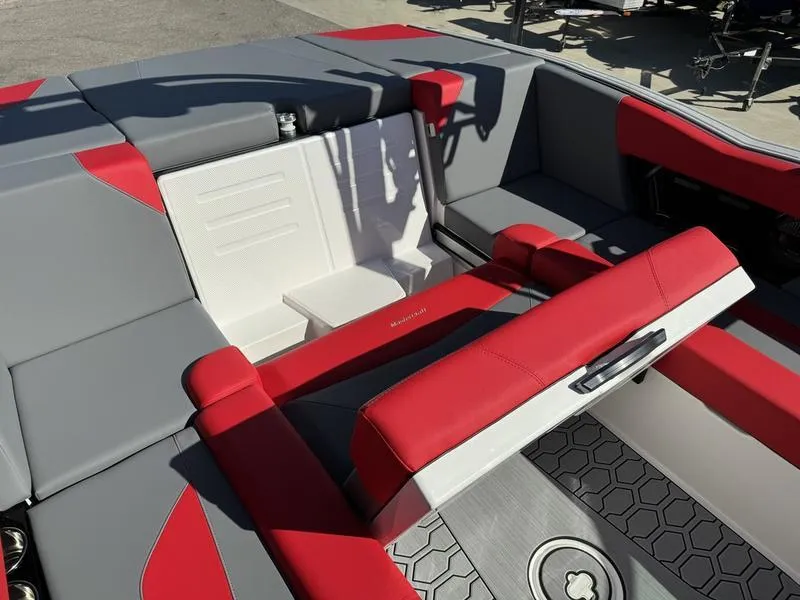 Slide: The Image of 2024 MasterCraft NXT 22 boat interior with red and gray seating. - 17