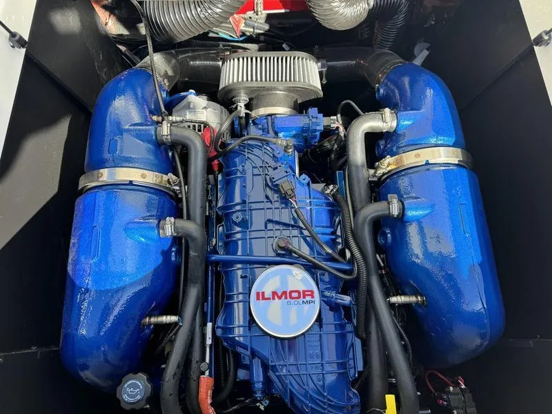 Slide: The Image of 2024 MasterCraft NXT 22 Ilmor engine in blue. - 28