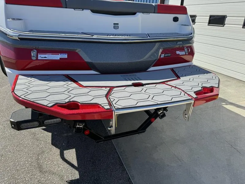 Slide: The Image of 2024 MasterCraft NXT 22 boat rear view with swim platform and ladder. - 3