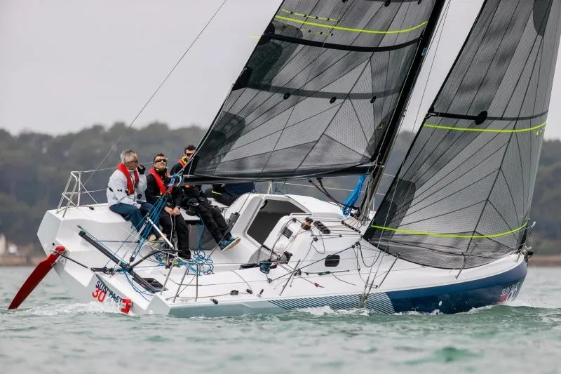 Slide: The Image of 2024 Jeanneau Sun Fast 30 One Design sailboat on water with crew. - 15