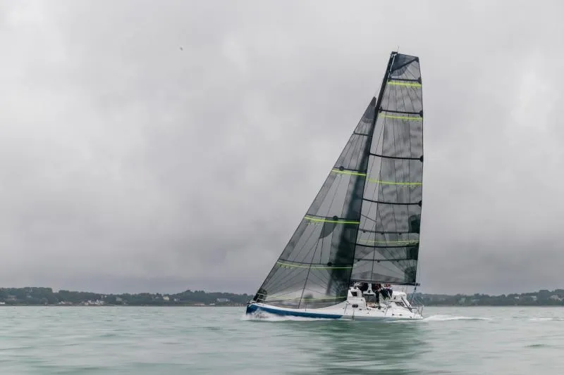 Slide: The Image of 2024 Jeanneau Sun Fast 30 One Design sailing on calm waters under cloudy skies. - 16