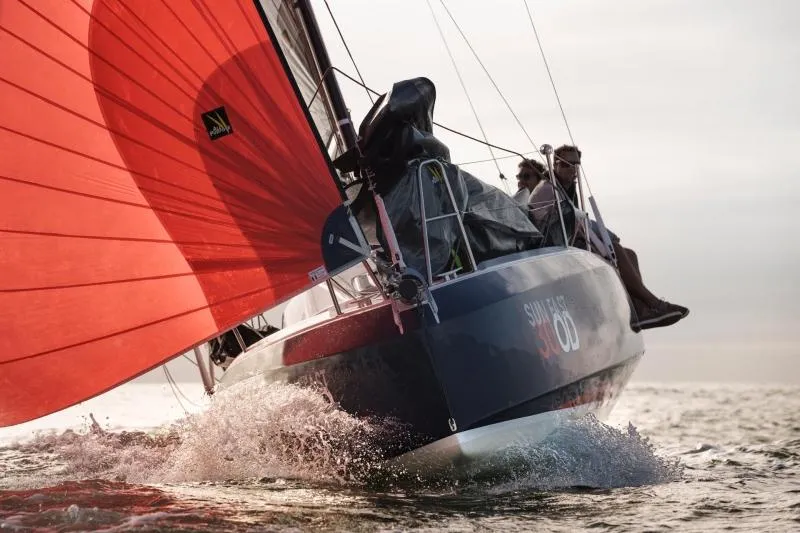 Slide: The Image of 2024 Jeanneau Sun Fast 30 One Design sailing with vibrant red sail on open water. - 9