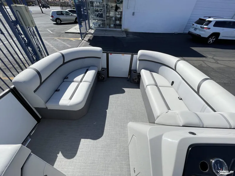 Slide: The Image of 2023 Crest 200 LX L Classic pontoon boat interior with spacious seating. - 4