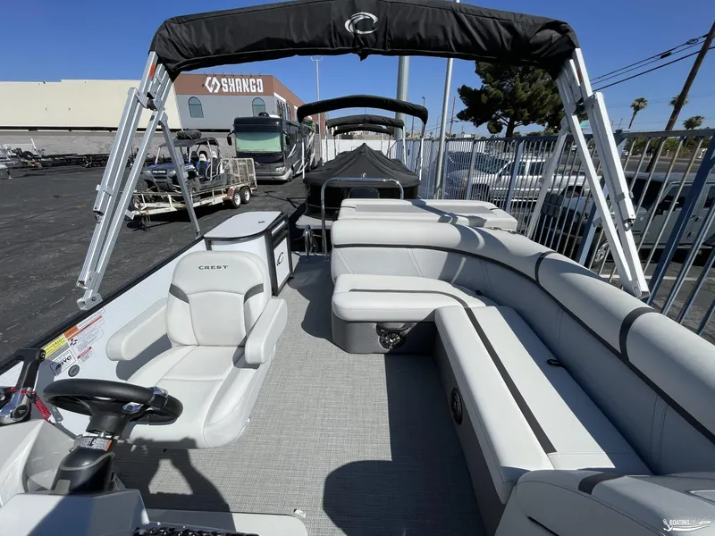 Slide: The Image of 2023 Crest 200 LX L Classic pontoon boat with spacious seating and modern design. - 5