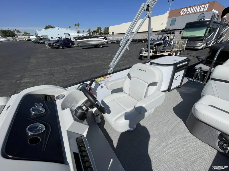 Slide: The Image of 2023 Crest 200 LX L Classic boat interior with captain's chair and dashboard. - 8