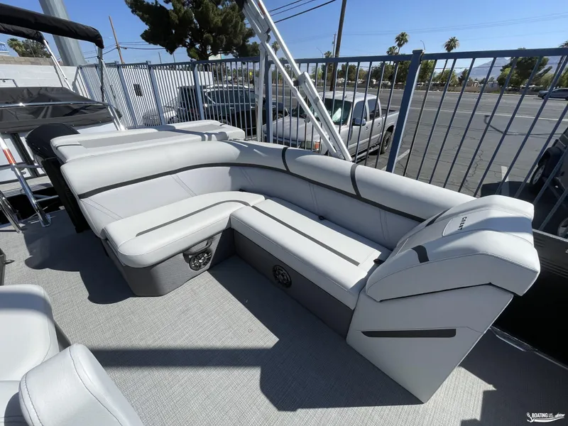 Slide: The Image of 2023 Crest 220 LX L Classic pontoon boat with spacious seating and modern design. - 5
