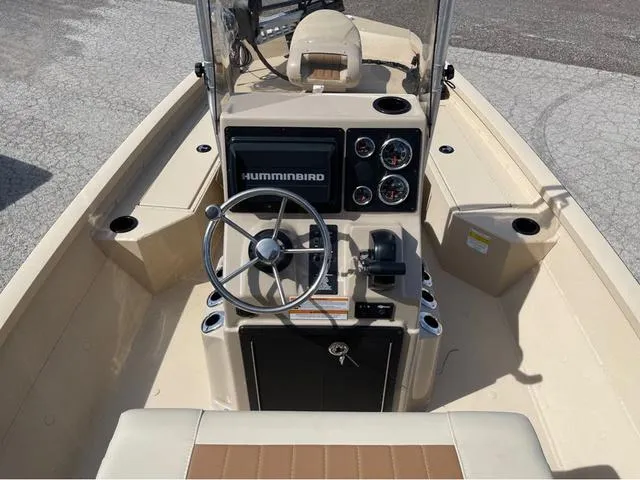 Slide: The Image of 2024 G3 Bay 18 GX boat console with Humminbird electronics and steering wheel. - 11