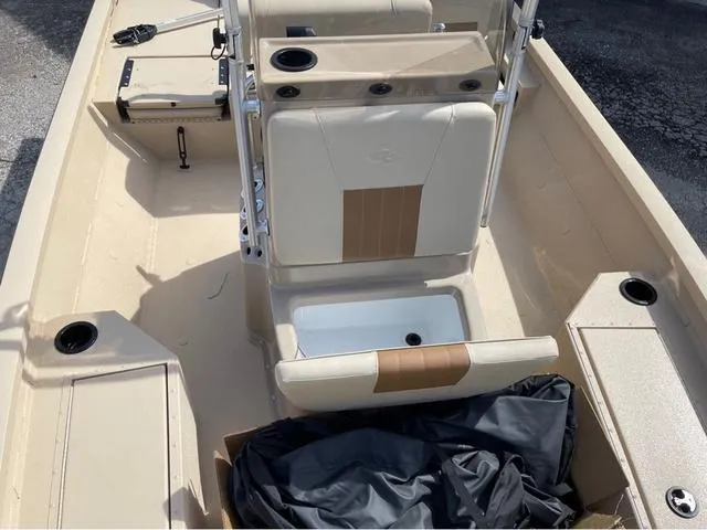 Slide: The Image of 2024 G3 Bay 18 GX boat interior with seating and storage compartments. - 13