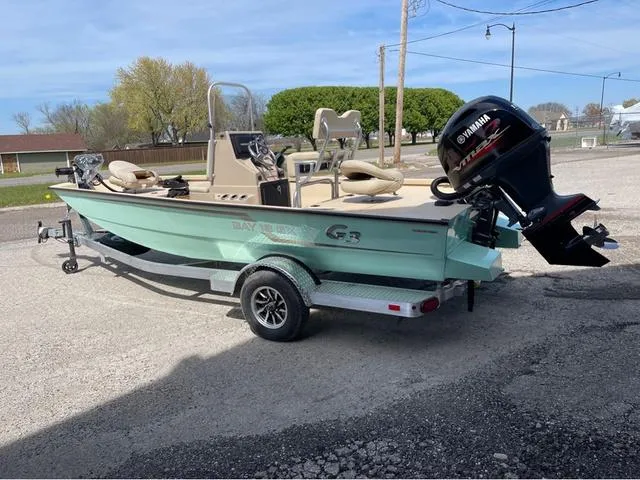 Slide: The Image of 2024 G3 Bay 18 GX boat on a trailer with Yamaha outboard motor. - 4