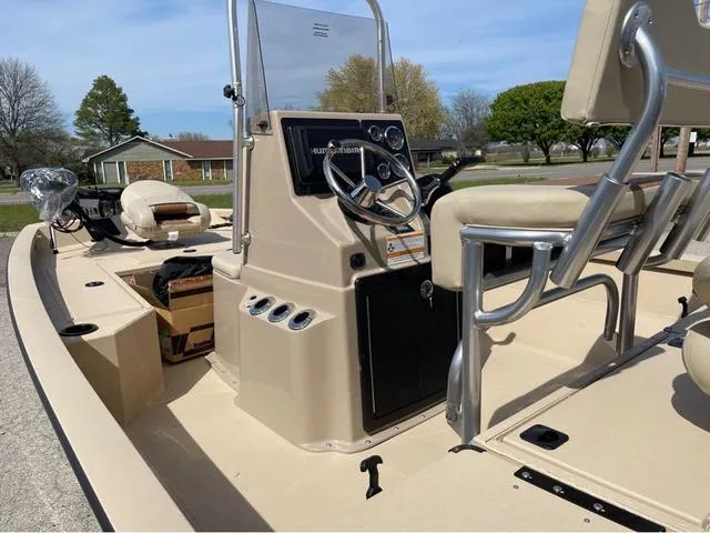 Slide: The Image of 2024 G3 Bay 18 GX boat interior with steering console and seating. - 6