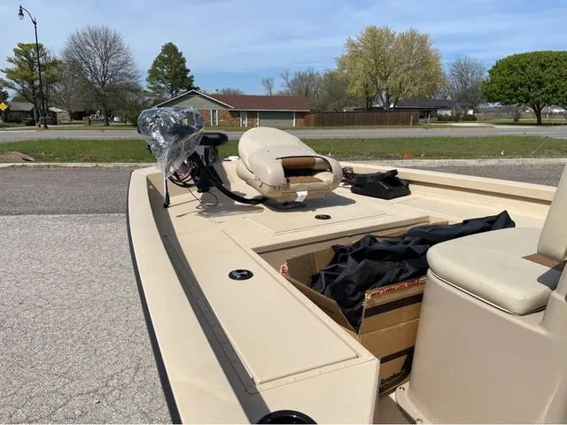 Slide: The Image of 2024 G3 Bay 18 GX boat interior with seating and storage compartments. - 7