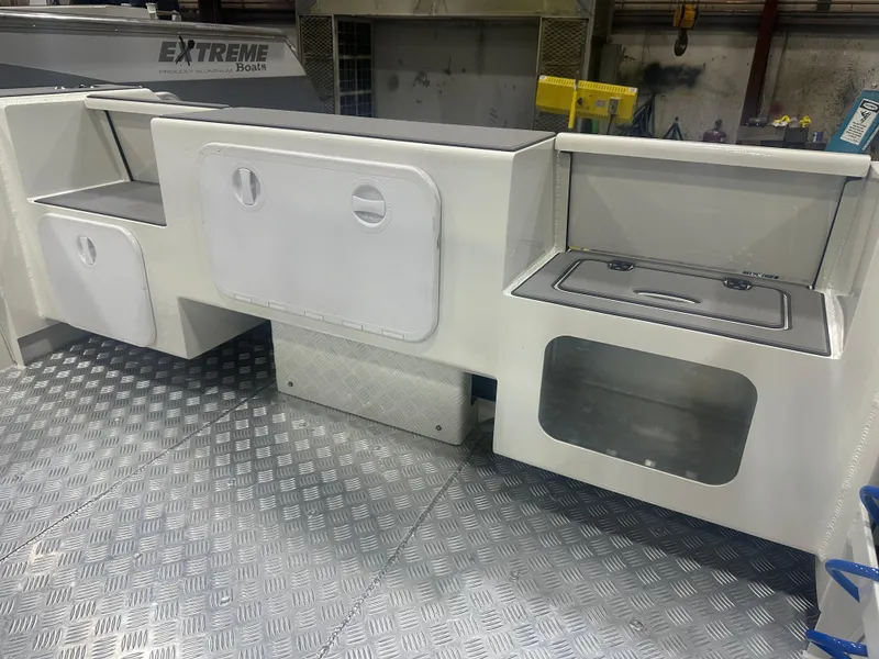 Slide: The Image of Twin Walk Through Transom on the Extreme Boats 645 Center Console - 12