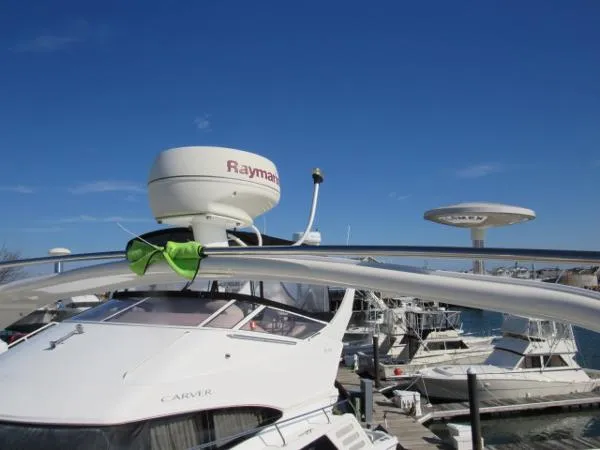 Slide: The Image of 2004 Silverton 330 Sport Bridge yacht with Raymarine radar at marina. - 25