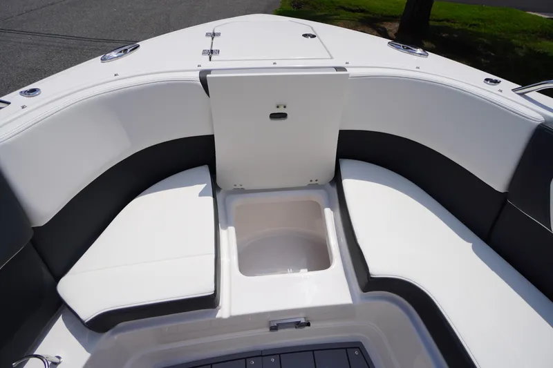 Slide: The Image of 2025 Chaparral 280 OSX boat interior with seating and storage compartment. - 15