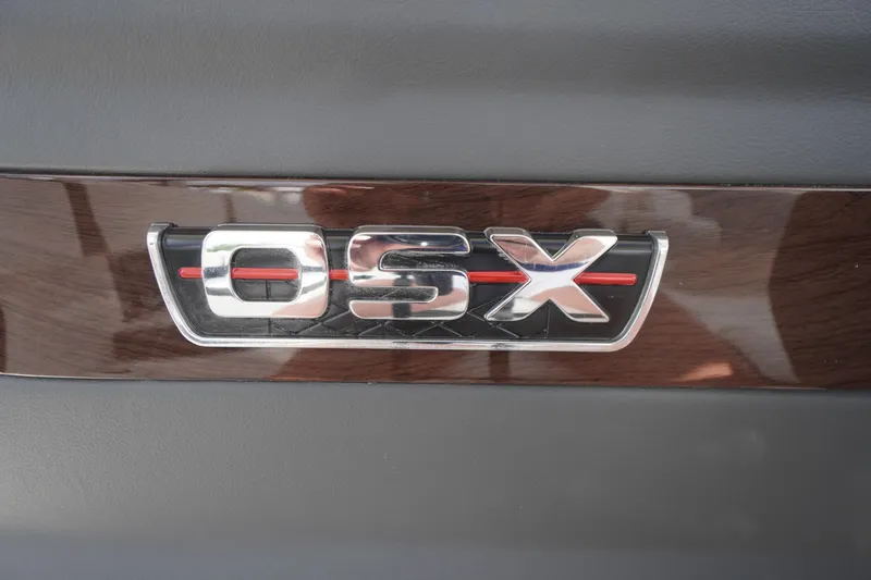 Slide: The Image of 2025 Chaparral 280 OSX logo on sleek wooden panel background. - 29