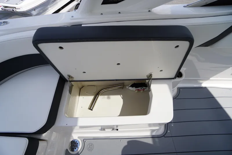 Slide: The Image of Open storage compartment on 2025 Chaparral 280 OSX boat, featuring sleek interior design. - 36