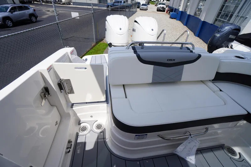 Slide: The Image of 2025 Chaparral 280 OSX boat interior with white seating and Yamaha outboard engines. - 39