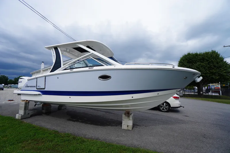 Slide: The Image of 2025 Chaparral 280 OSX boat on display, showcasing sleek design and modern features. - 54