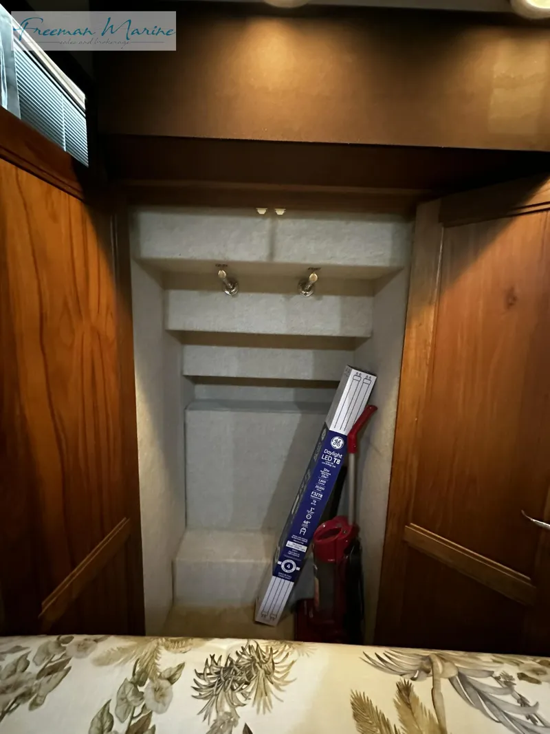 Slide: The Image of Interior of 1988 Carver 4207 Aft Cabin with storage space and wooden cabinetry. - 12