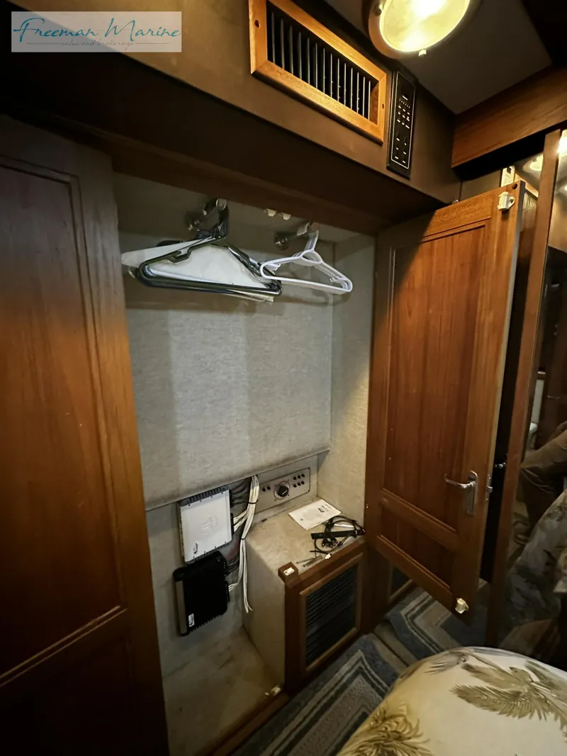 Slide: The Image of Interior closet of 1988 Carver 4207 Aft Cabin with hangers and storage. - 13