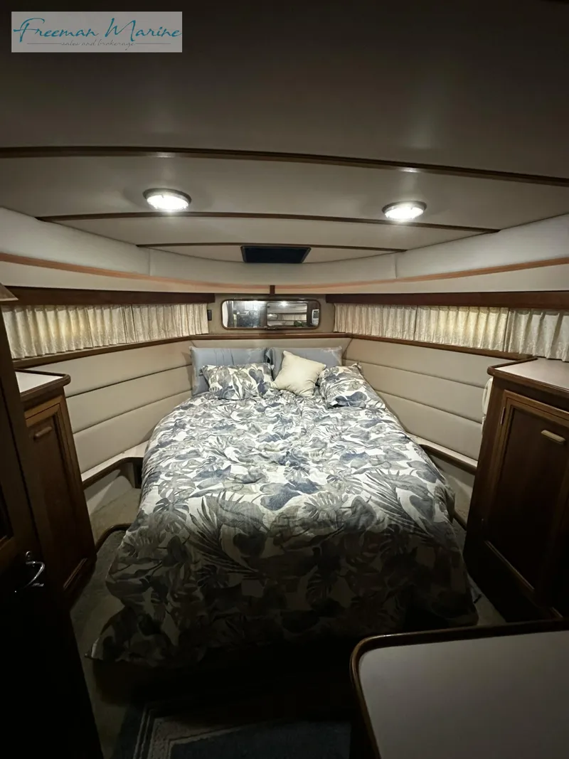 Slide: The Image of Cozy bedroom in 1988 Carver 4207 Aft Cabin yacht with floral bedding. - 22