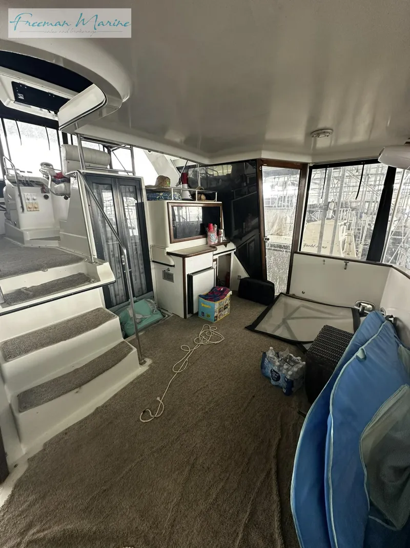 Slide: The Image of 1988 Carver 4207 Aft Cabin interior with carpeted floor and staircase. - 8