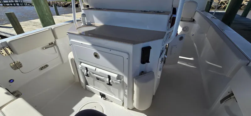 Slide: The Image of 2023 Sea Hunt Escape 250 boat interior with storage compartments and seating. - 18