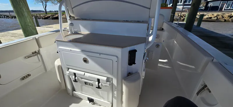 Slide: The Image of 2023 Sea Hunt Escape 250 boat interior with storage compartments and seating. - 19