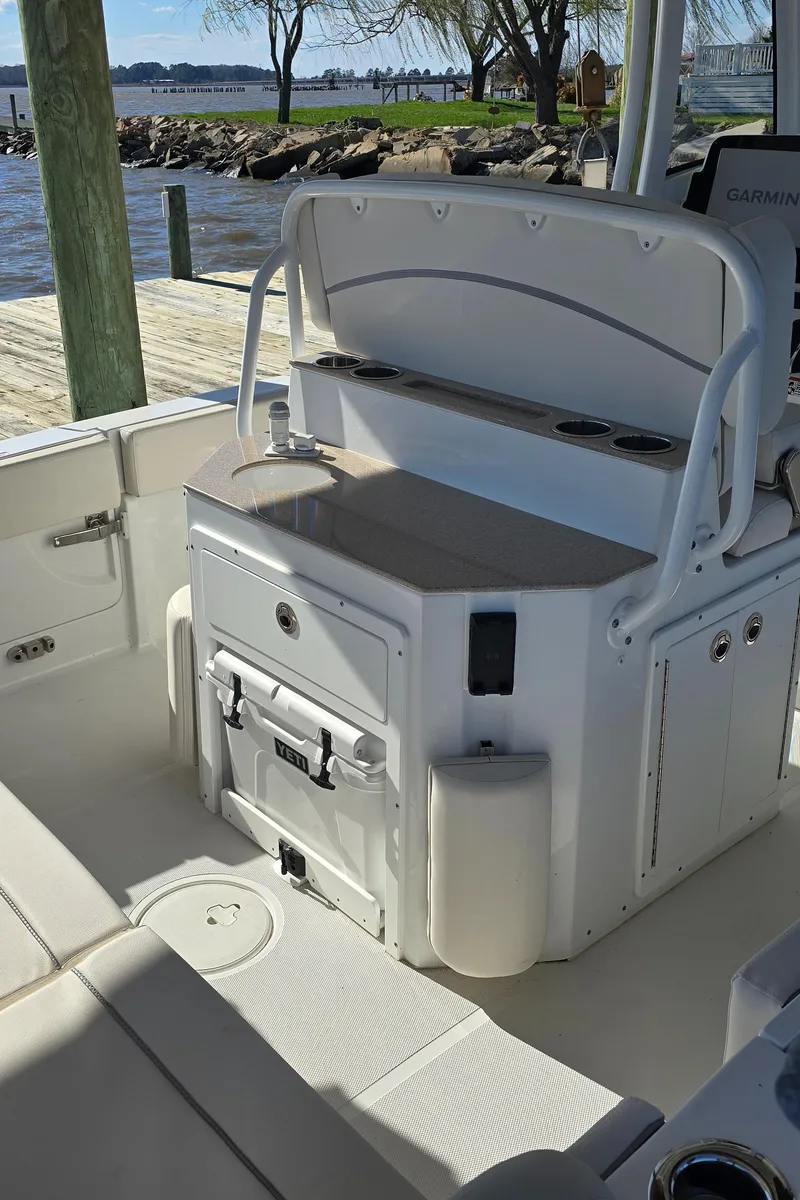 Slide: The Image of 2023 Sea Hunt Escape 250 boat interior with seating and storage. - 24