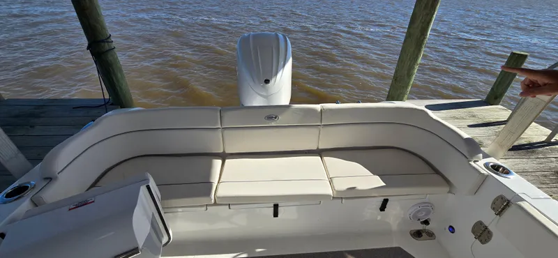 Slide: The Image of 2023 Sea Hunt Escape 250 boat with rear seating and outboard motor. - 3