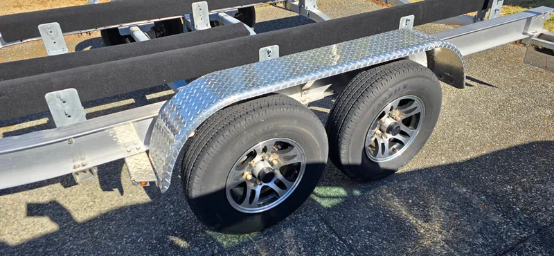 Slide: The Image of 2023 Sea Hunt Escape 250 boat trailer with dual axle and diamond plate fenders. - 38