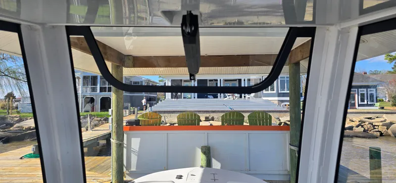 Slide: The Image of View from a 2023 Sea Hunt Escape 250 boat docked at a waterfront property. - 8