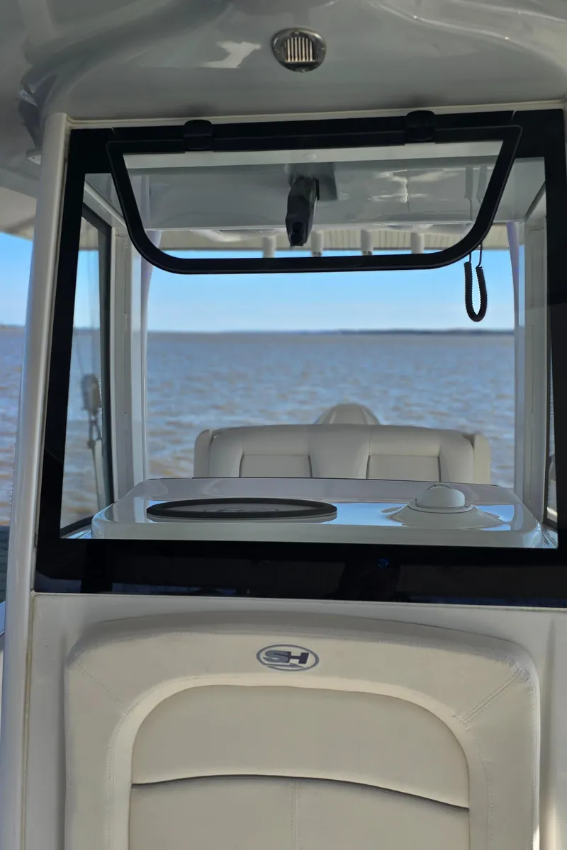 Slide: The Image of 2023 Sea Hunt Escape 250 boat interior with ocean view. - 9