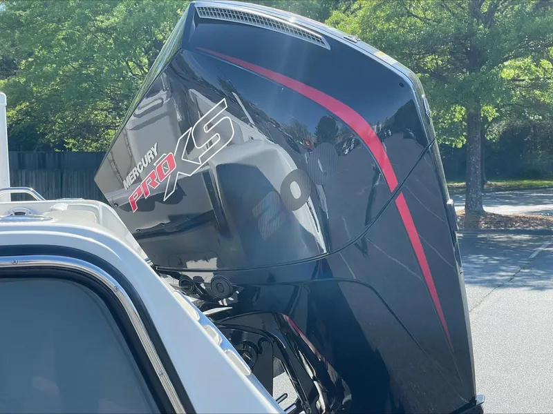 Slide: The Image of 2024 Mako 214 CC boat with Mercury Pro XS outboard motor. - 4