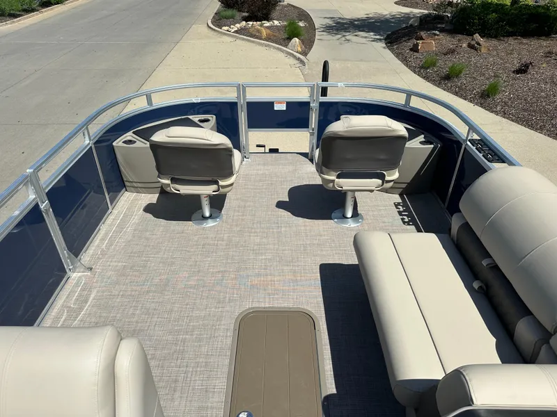Slide: The Image of 2024 Sun Tracker Fishin' Barge 22 XP3 pontoon boat interior with seating and fishing chairs. - 3