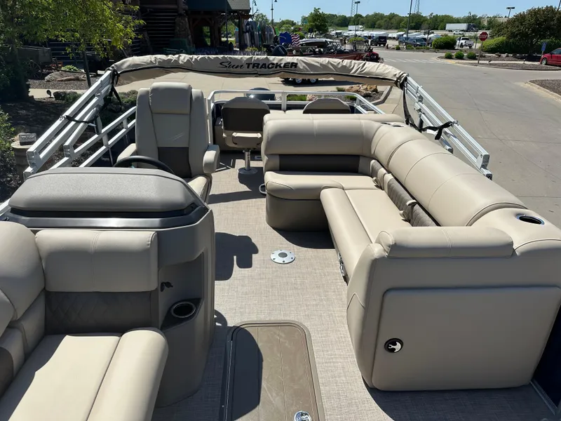 Slide: The Image of 2024 Sun Tracker Fishin' Barge 22 XP3 pontoon boat with spacious seating and modern design. - 7