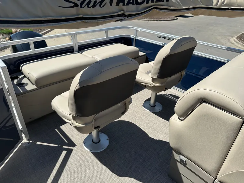 Slide: The Image of 2024 Sun Tracker Fishin' Barge 22 XP3 interior with comfortable seating. - 8