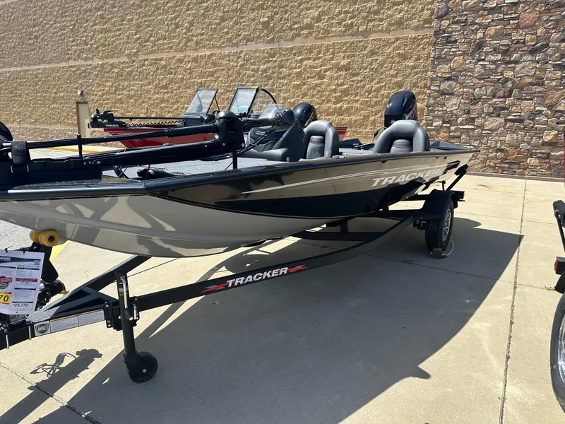 Slide: The Image of 2024 Tracker Pro Team 175 TXW fishing boat on trailer, parked outdoors. - 3