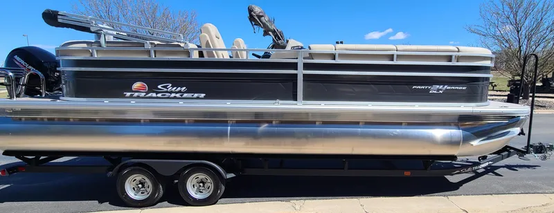 Slide: The Image of 2024 Sun Tracker Party Barge 24 DLX pontoon boat on a trailer. - 3