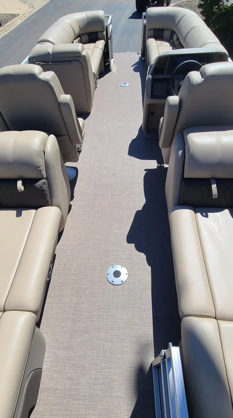 Slide: The Image of 2024 Sun Tracker Party Barge 24 DLX interior with spacious seating and modern design. - 5